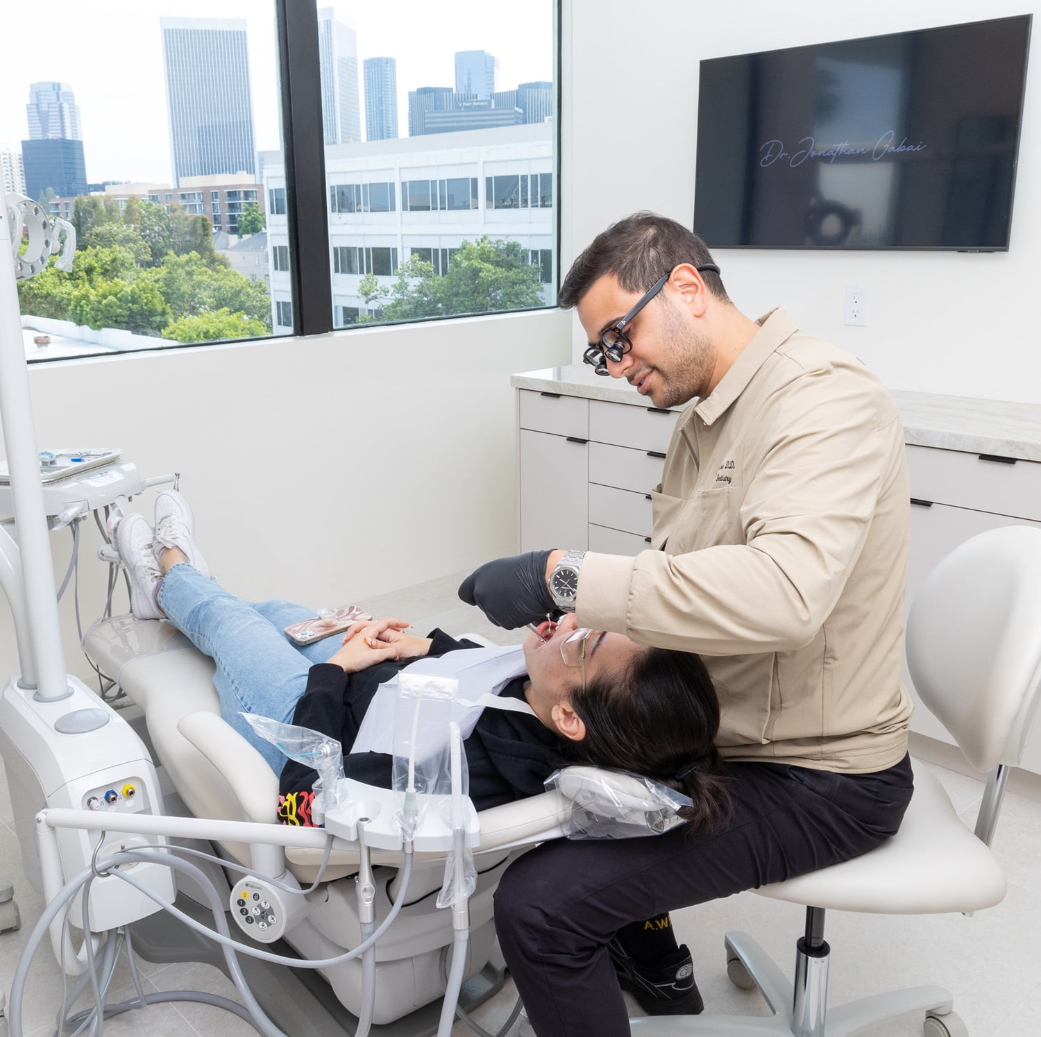 Patient receiving professional care from cosmetic dentist 